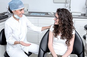 Patient and dentist engaged in pleasant conversation