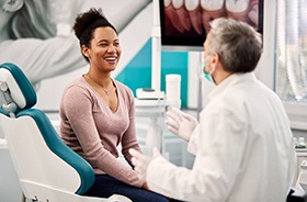 Dentist answering a patient’s questions about dental implants in Torrington