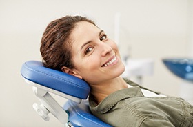 Female dental patient relaxing before implant placement surgery