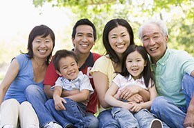 Three generations of family smiling together