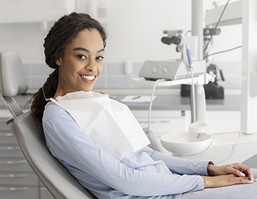 Smiling woman sitting in dental chair