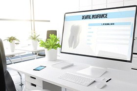 Dental insurance form displayed on large computer monitor