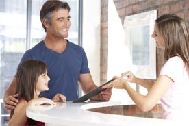 Man learning about his options for paying for emergency dentistry