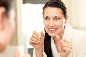 Closeup of person flossing