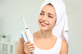 Woman holding toothbrush