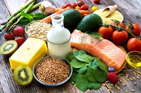 Variety of healthy foods arranged on wooden tabletop