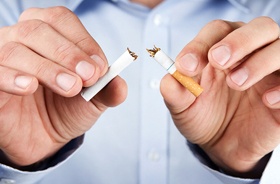 Man quitting smoking to protect his oral health