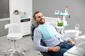Man at checkup to care for his dental implants