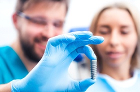 Dentist and patient discussing candidacy for dental implants