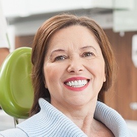 Smiling older woman in dental chair