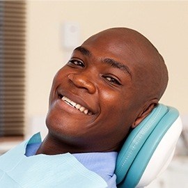 Smiling man in dental chair