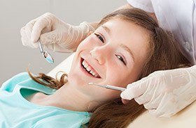 Smiling child in dental chair