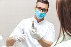 dentist explaining dental implants