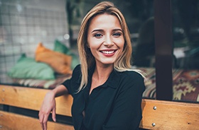 Smiling professional woman, enjoying the benefits of veneers