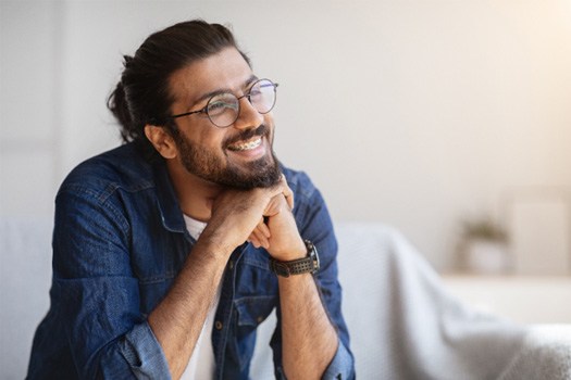 Man smiling with braces