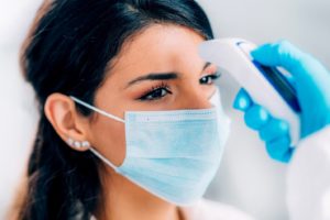 dental team member getting temperature checked before work