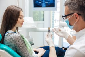 Patient wondering if dental implants are worth the cost