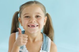 Happy child with missing front teeth