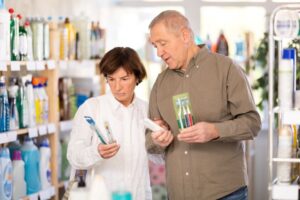 Middle-aged couple shopping for toothbrushes