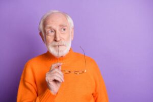 Senior man wearing curious expression 